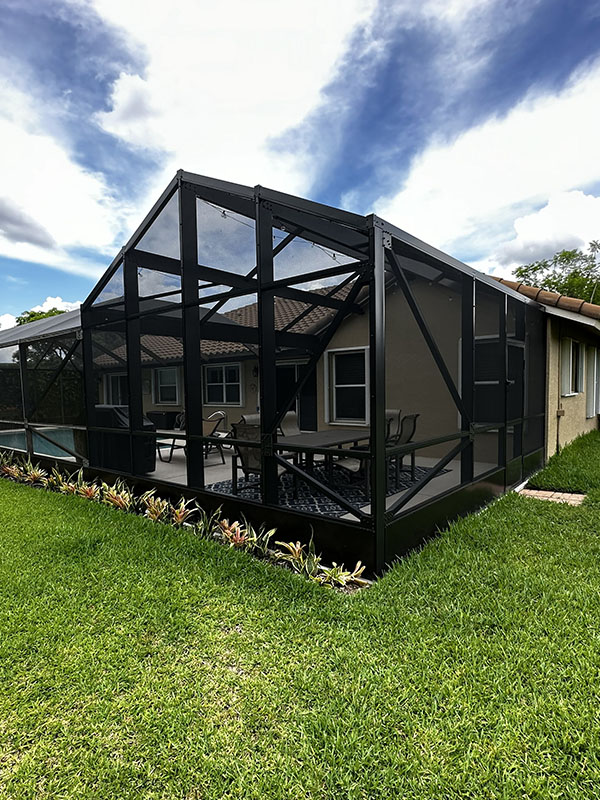 Black pool enclosure in backyard