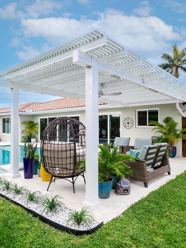 White pergola in backyard kitchen