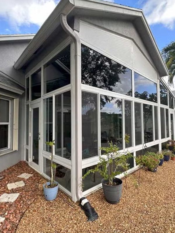 White sunroom in backyard
