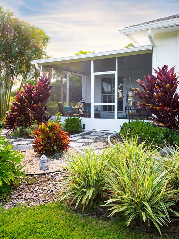 White sunroom in backyard